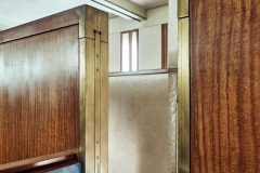 Wooden panel with brass fixtures