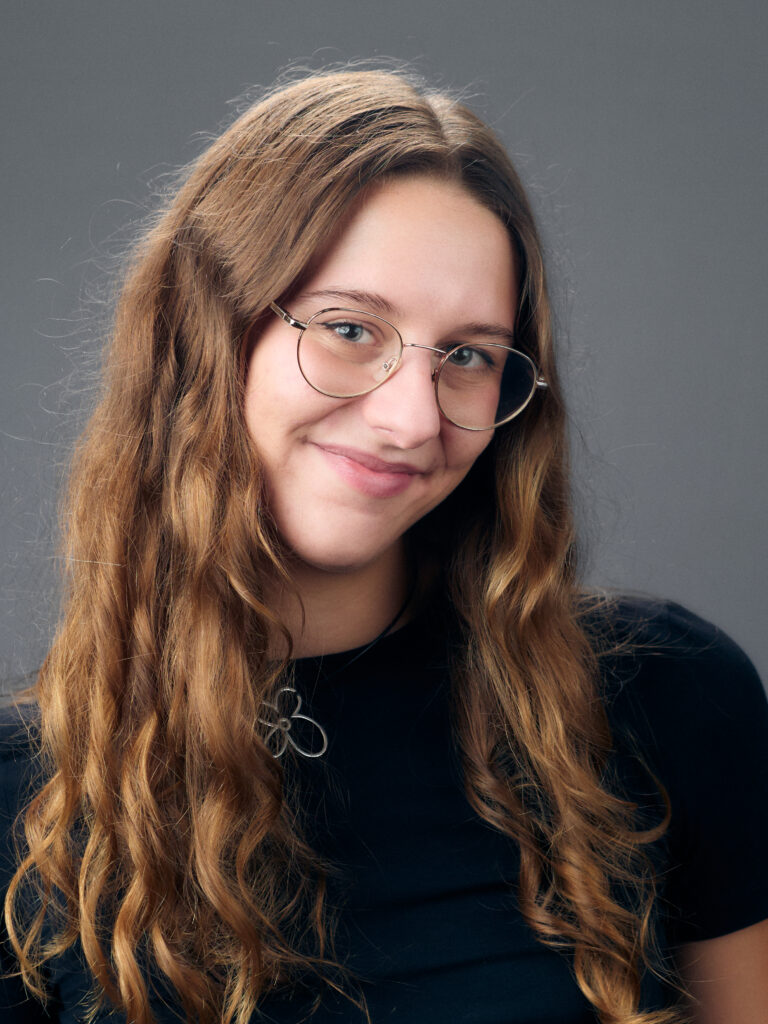 young girl in glasses