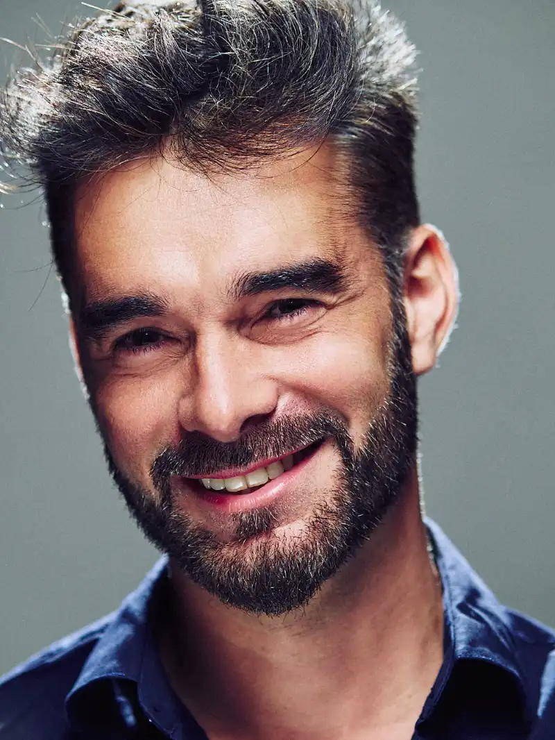 Studio portrait of a smiling man
