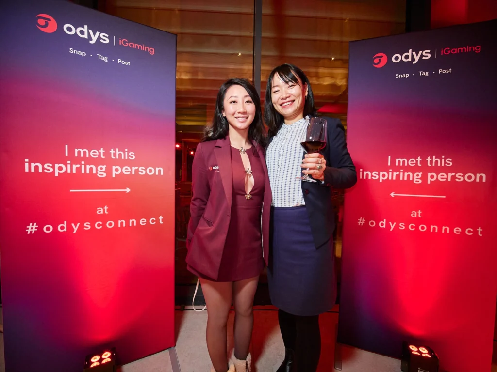 Group of Odys clients and hosts sharing a genuine laugh during the networking event at Nuara restaurant in Barcelona's Port Vell.