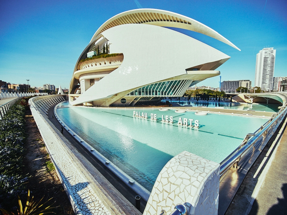 Modern curved architecture of Valencia’s City of Arts and Sciences reflected in water