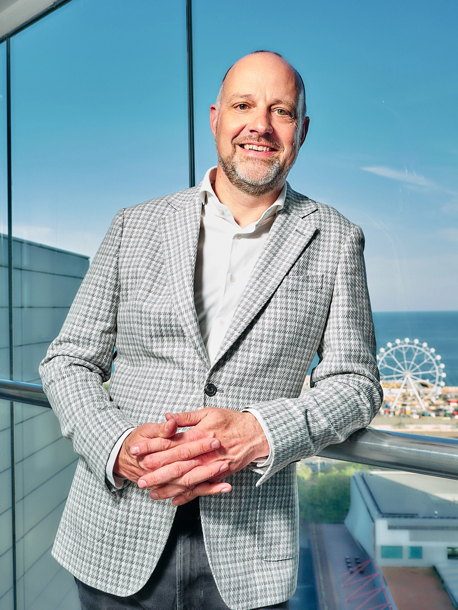 Corporate headshot of a business man in a modern Barcelona hotel.