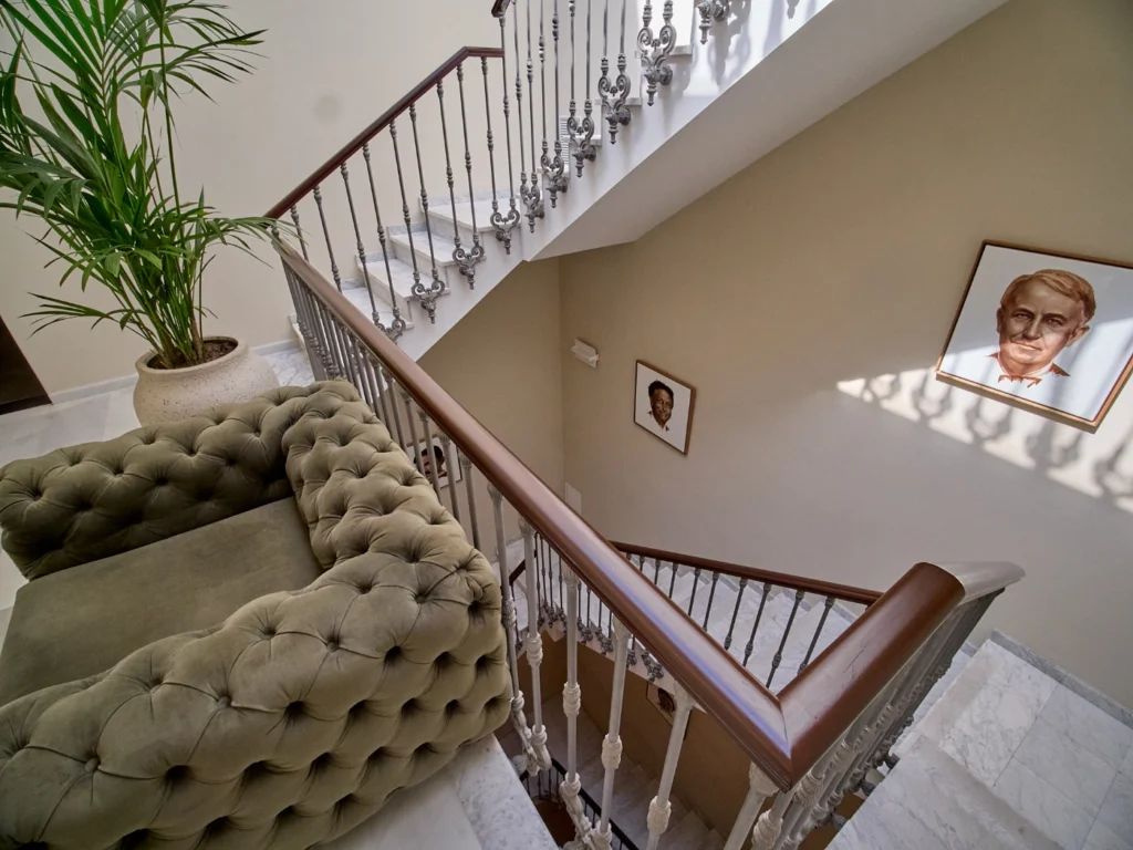 An elegant modern staircase with clean architectural lines in a premium Barcelona coworking building, designed for both functionality and aesthetic appeal. 