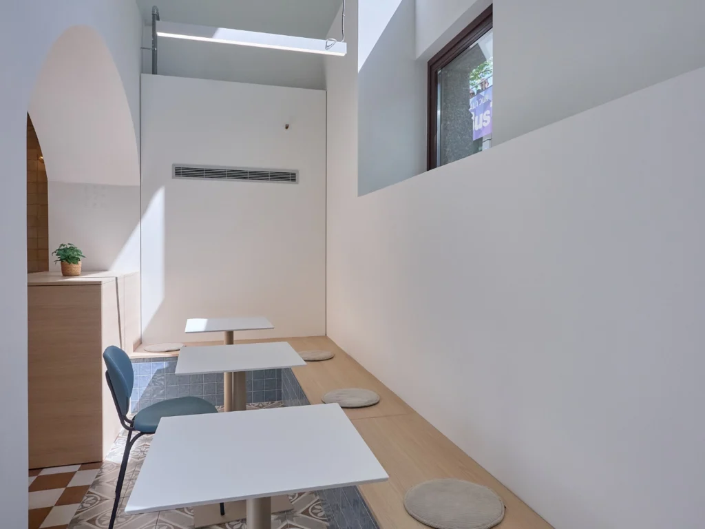 A versatile dining space with a large communal table, designed for meals, collaborative work, or team meetings.