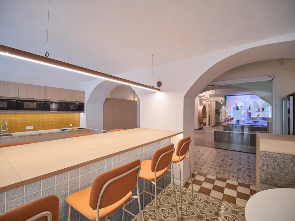 A perspective view highlighting the seamless flow and connectivity of work and social spaces. 