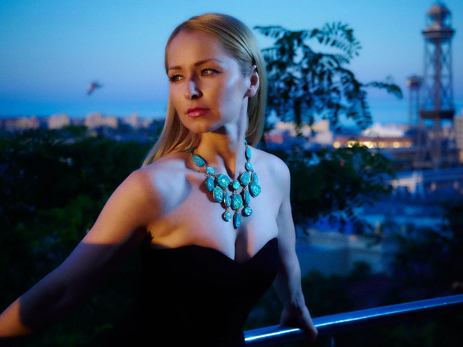 a blonde girl at dusk on Monjuic