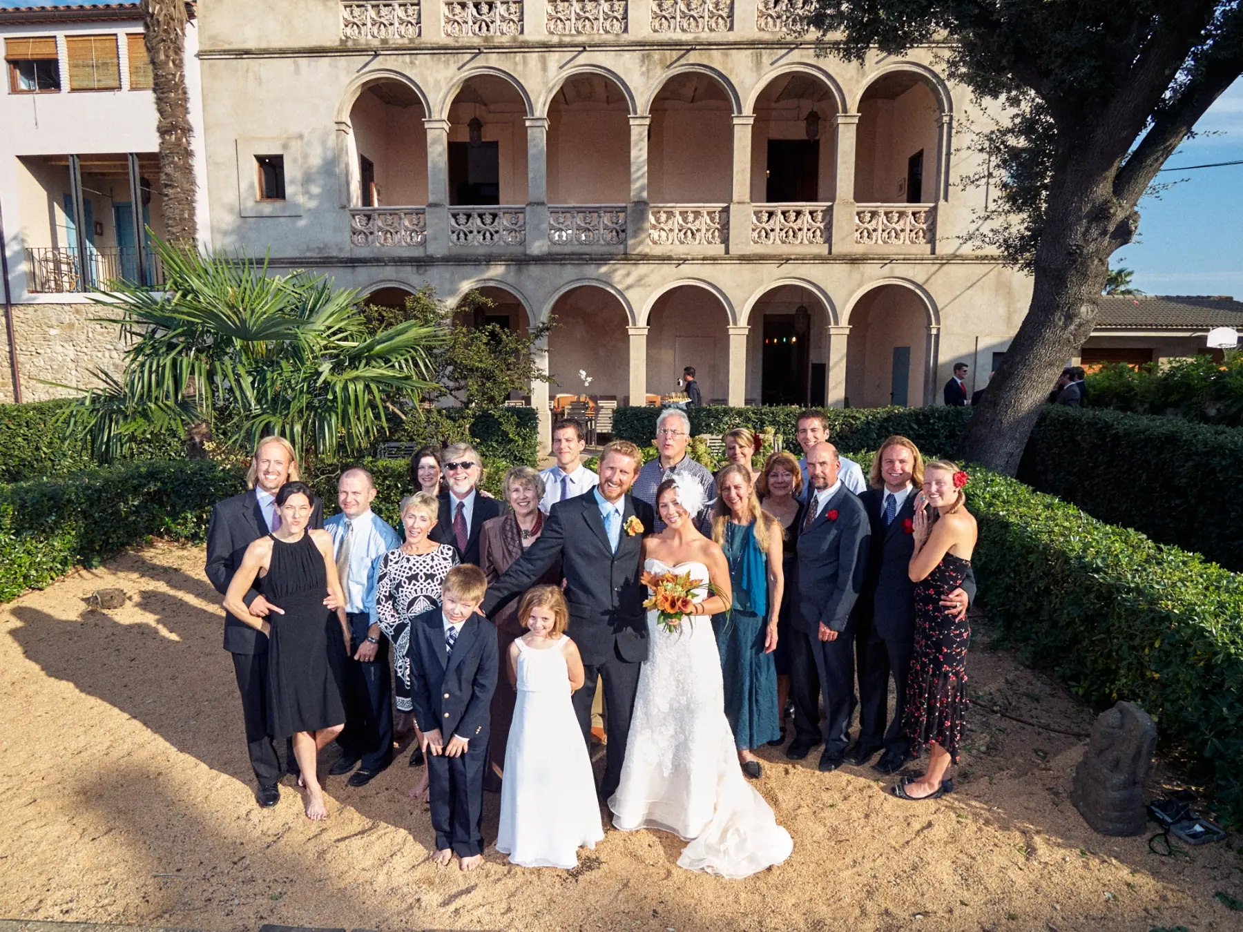 Wedding party group portrait outside Can Tallada