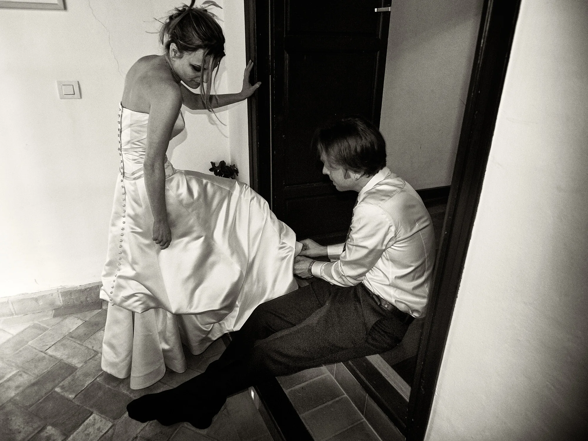 Drea & Brian Granada Wedding – Wedding Dress Brian helping Drea with her wedding dress before the ceremony