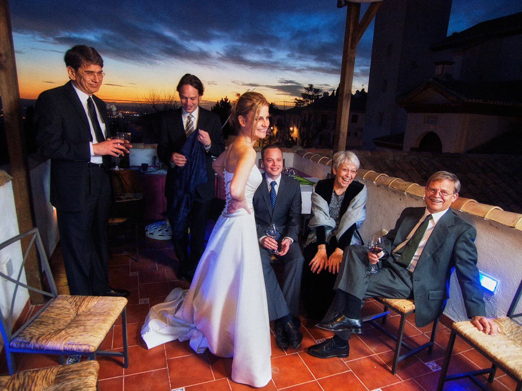 Drea & Brian Granada Wedding – Terrace Celebration Drea celebrating with family and friends on the Granada terrace at dusk