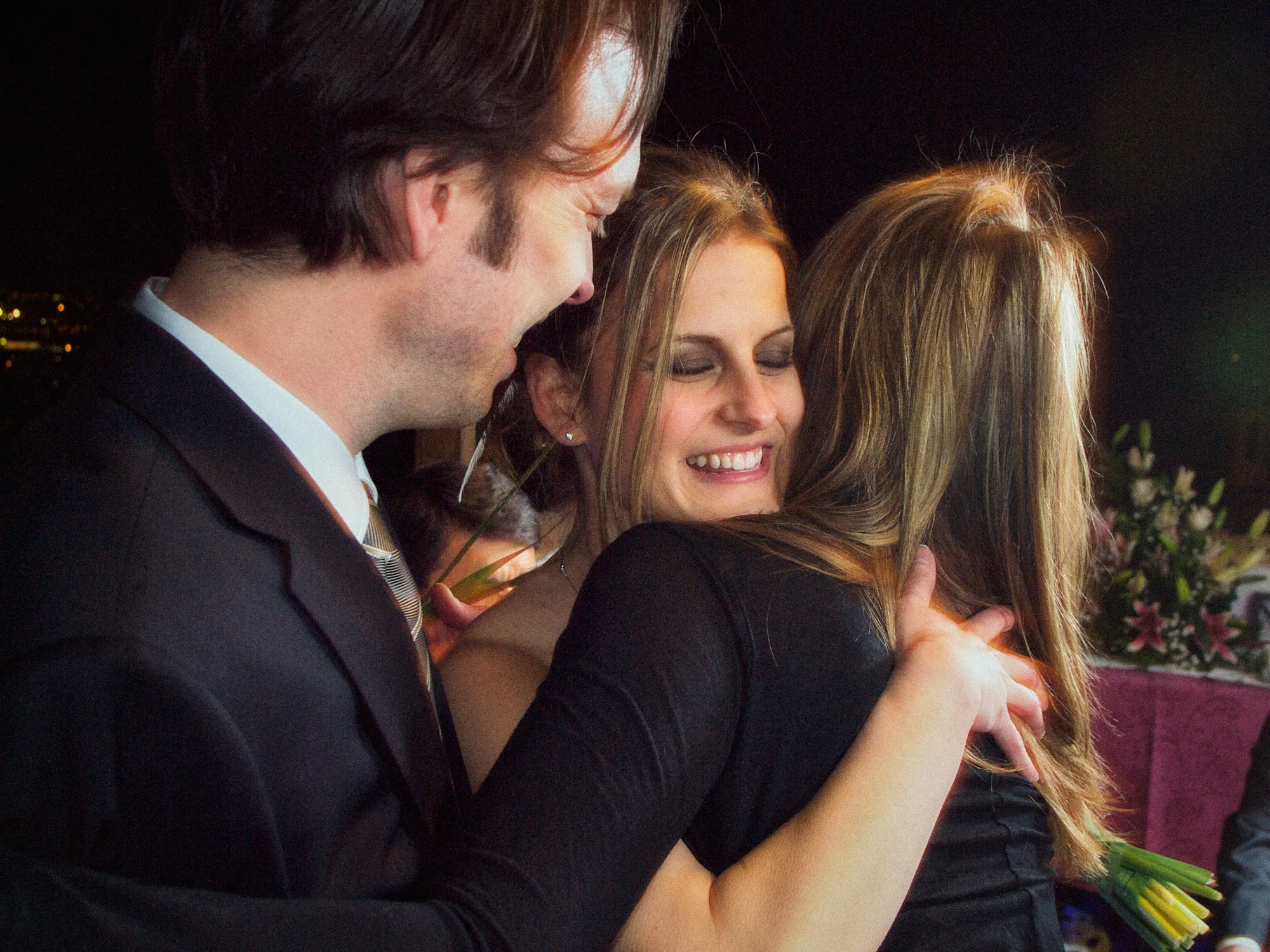 Drea & Brian Granada Wedding – Guest Embrace A wedding guest embracing Drea during the Granada celebration