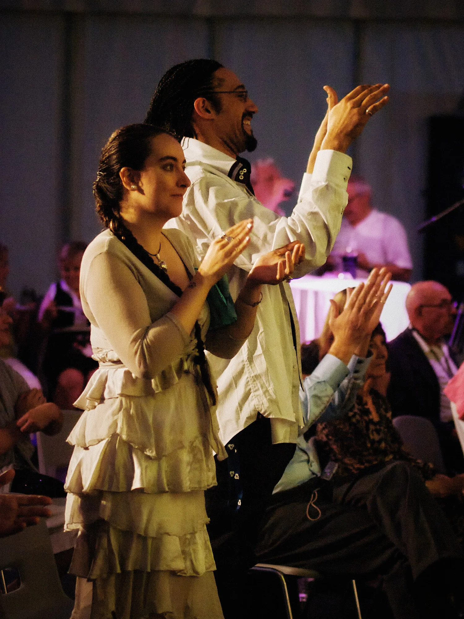 Emily & Regis Cardona Wedding – Forum Performer A performer with guests at Emily and Regis’ Forum celebration