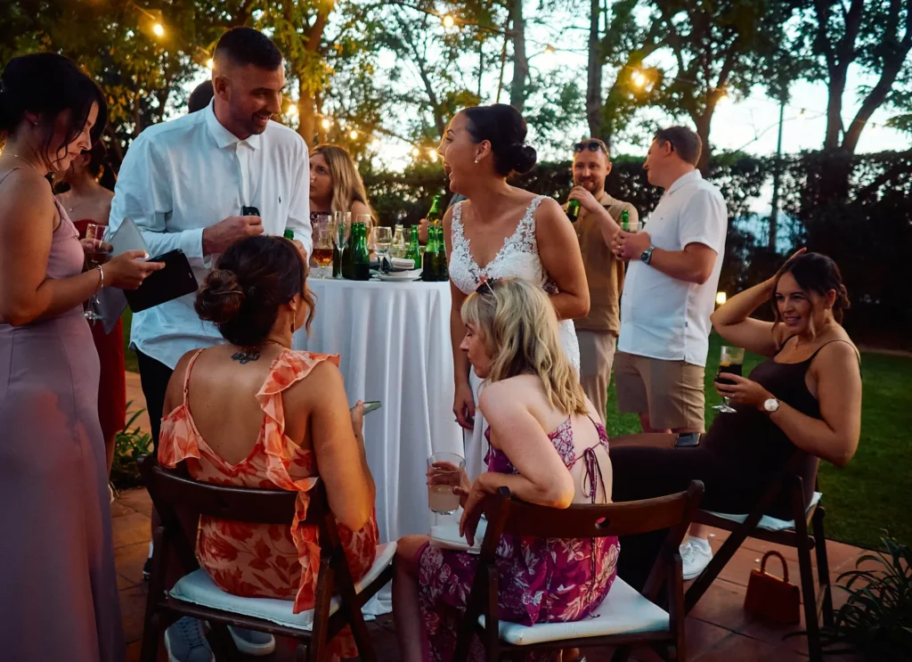 Jade and Aidhan with guests during their evening reception at Hotel Miramar