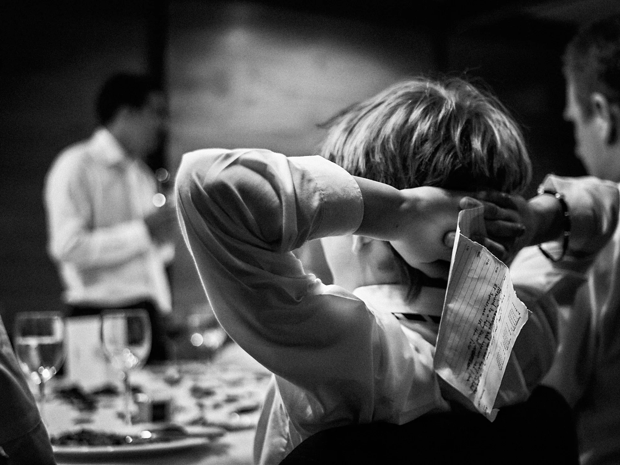 Jose and Kristy’s Barcelona Wedding – Reception Moment Wedding guest laughing at the reception table in Barcelona