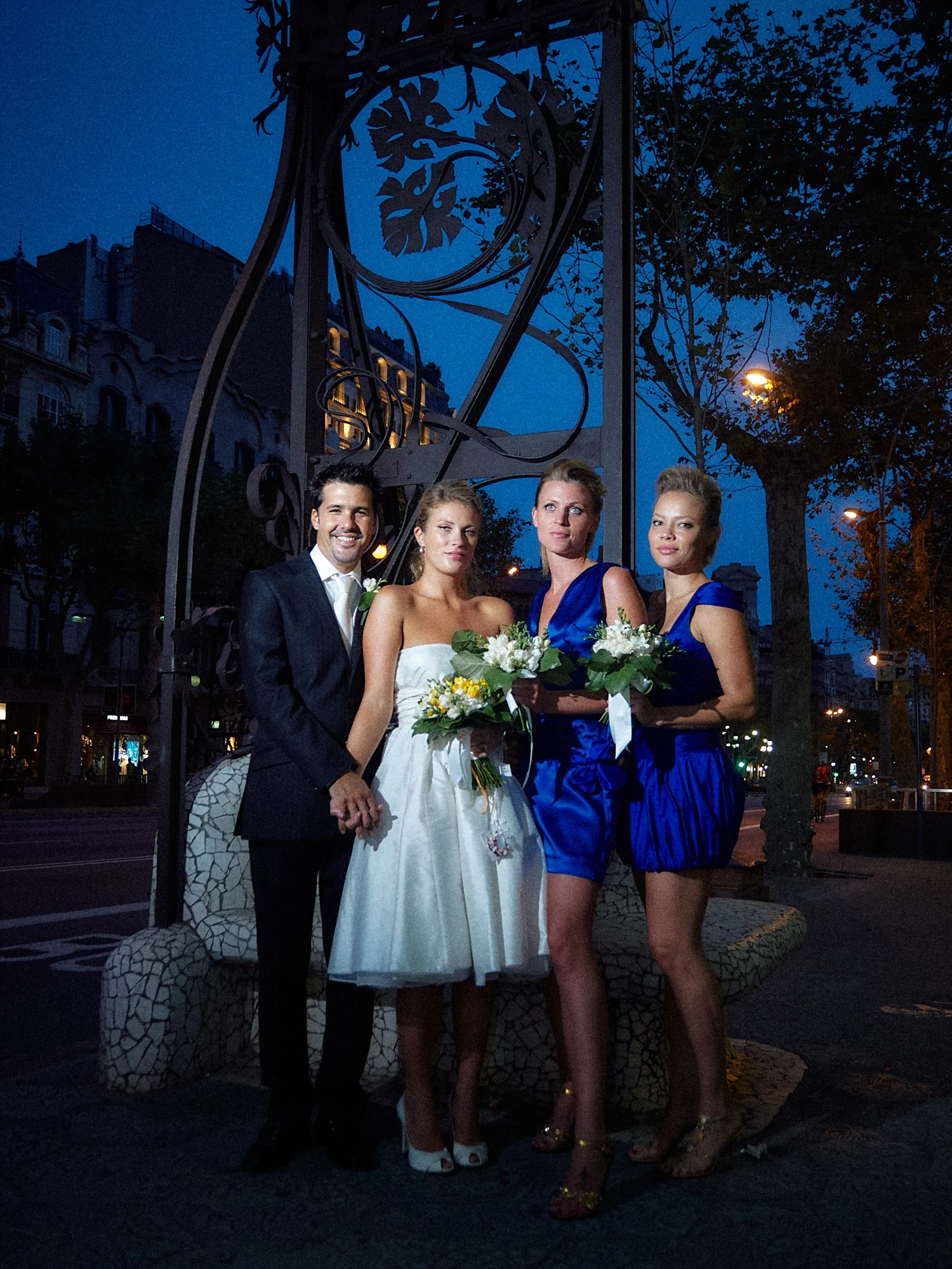 Jose and Kristy’s Barcelona Wedding – Night Portrait Bride with wedding guests outside at night in Barcelona