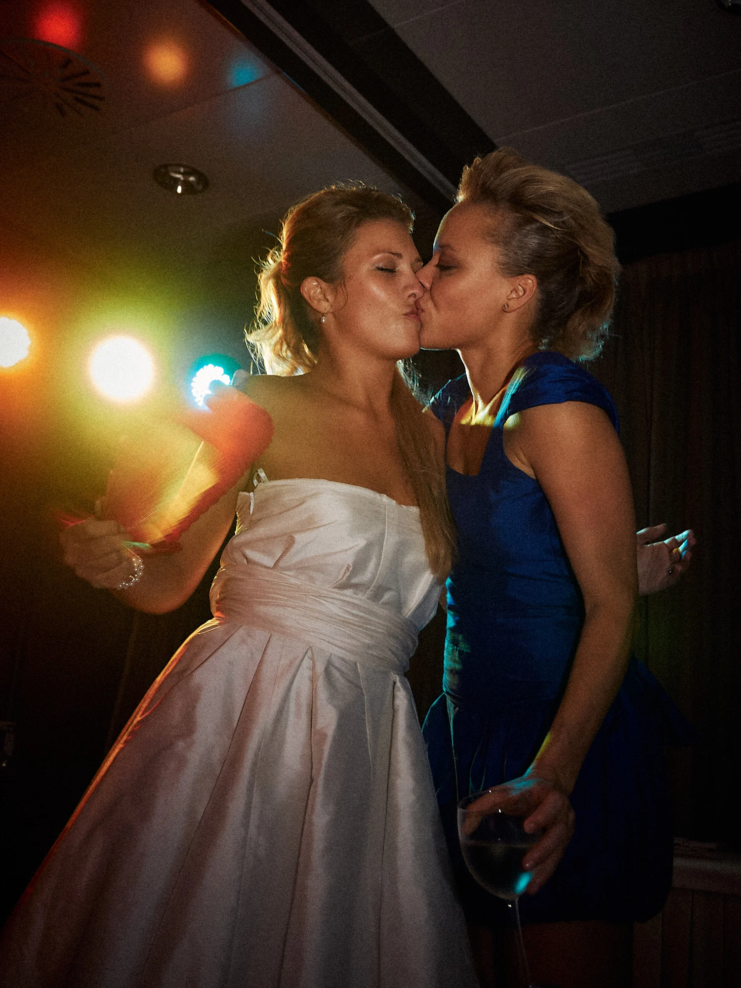 Jose and Kristy’s Barcelona Wedding – Evening Celebration Bride kissing a wedding guest during the evening celebration in Barcelona