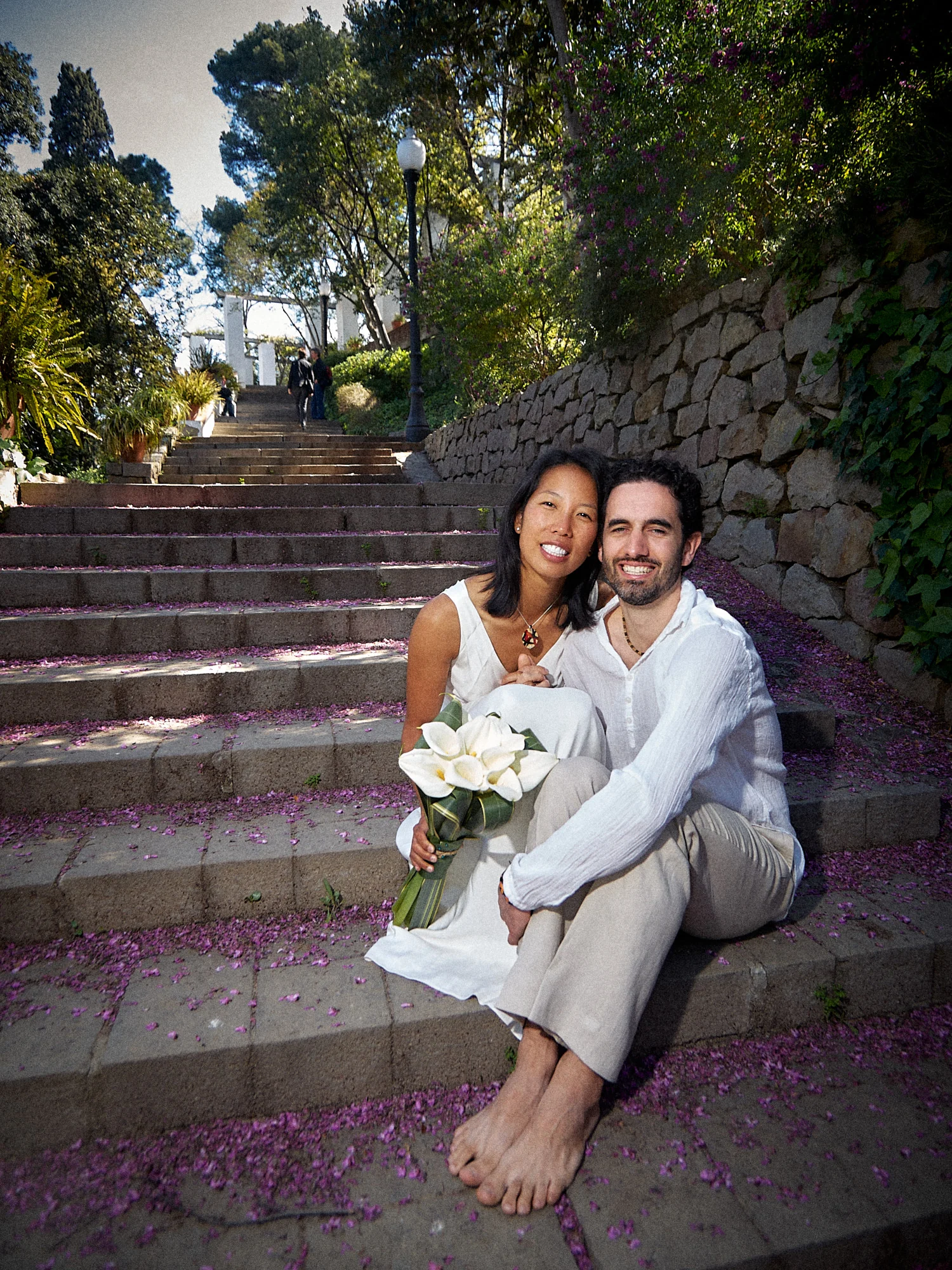 Rod and Vanessa sitting together on stone steps in Montjuïc
